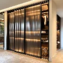 Black Fluted-Glass Wardrobe, Warmly Lit.webp